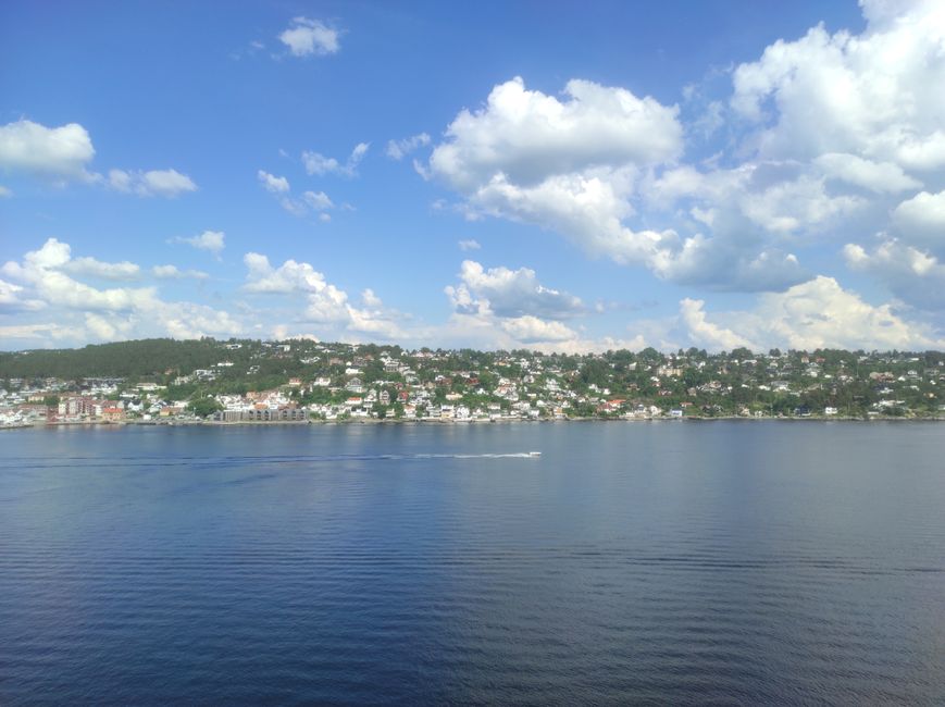 Beautiful landscape of Oslofjord with clouds and serene waters, capturing Oslo's scenic beauty.