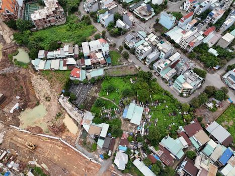 Aerial view of a densely populated urban neighborhood with diverse architecture in Ho Chi Minh City, Vietnam.