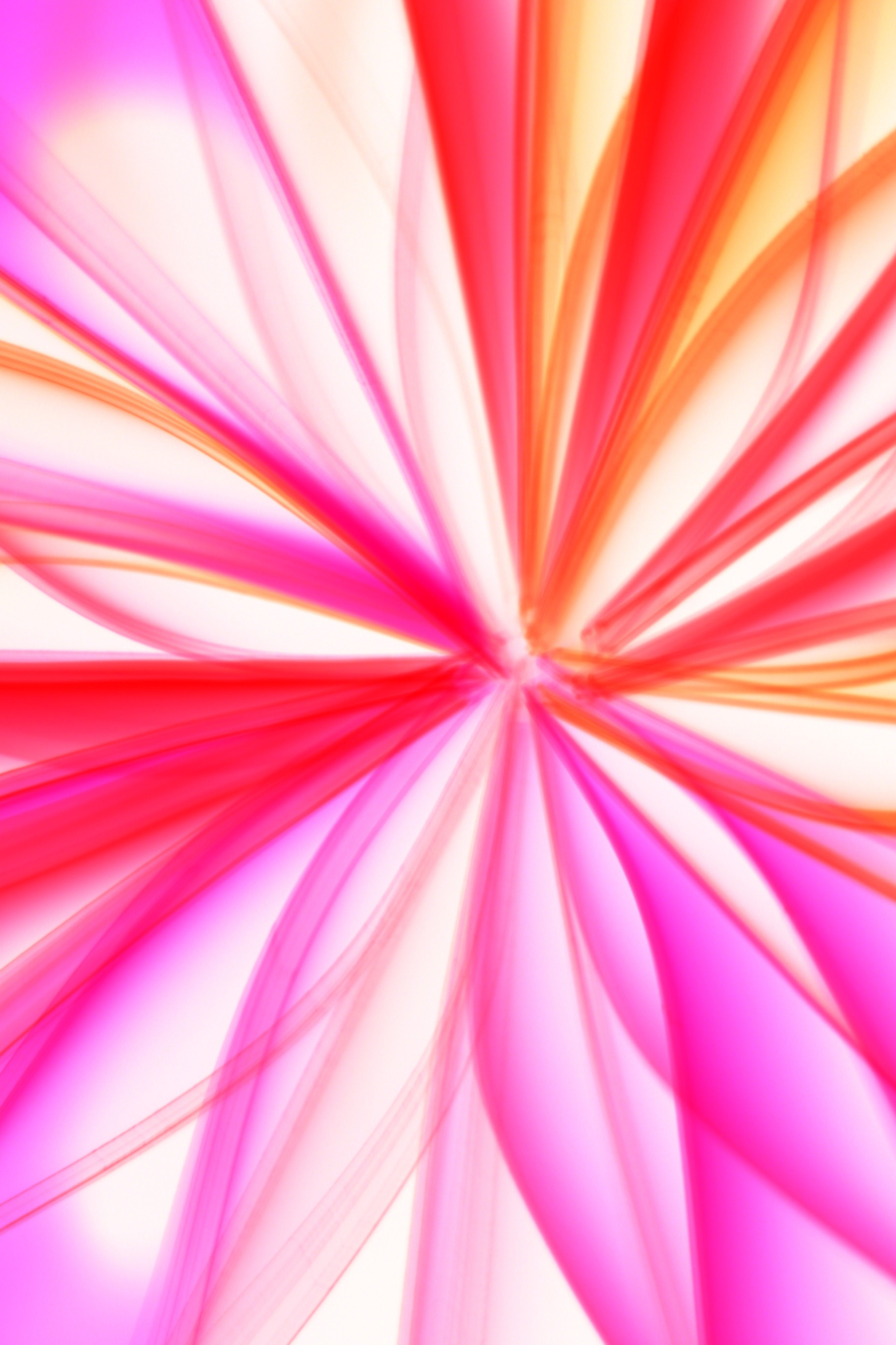 Colorful abstract image featuring dynamic pink and orange light streaks, creating a vibrant visual effect.