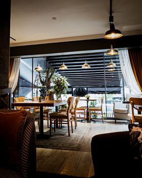 A welcoming modern cafe interior with warm lighting and stylish decor in Ankara, Türkiye.