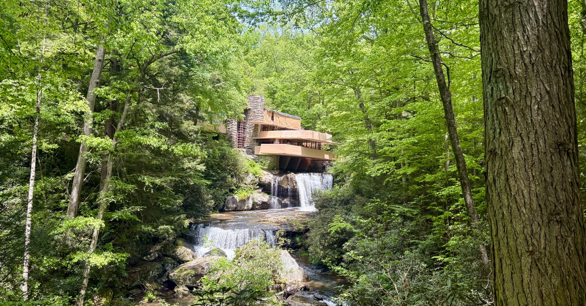 Iconic Fallingwater house amidst vibrant spring greenery in Pennsylvania.