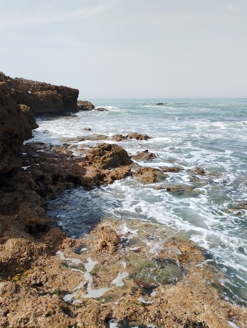 Free Beautiful view of rocky coastline with waves crashing in Casablanca, Morocco. Stock Photo