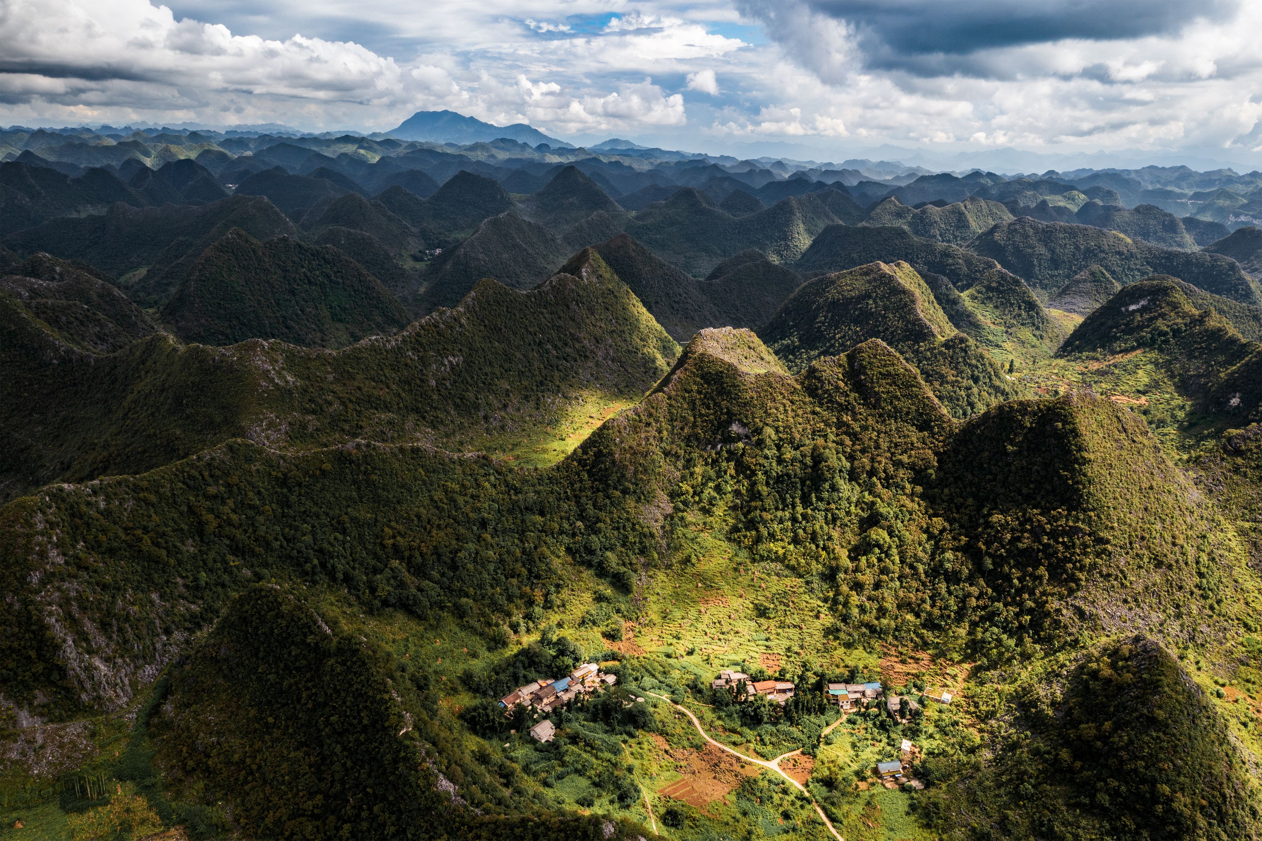 Aerial View of Lush Green Mountain Ranges · Free Stock Photo
