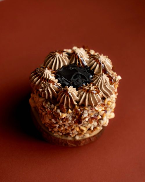 Free Delicious chocolate hazelnut cake with rich frosting, perfect for dessert lovers. Stock Photo