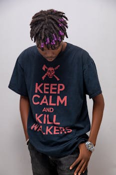 Portrait of a stylish young adult with graphic tee and unique hairstyle.