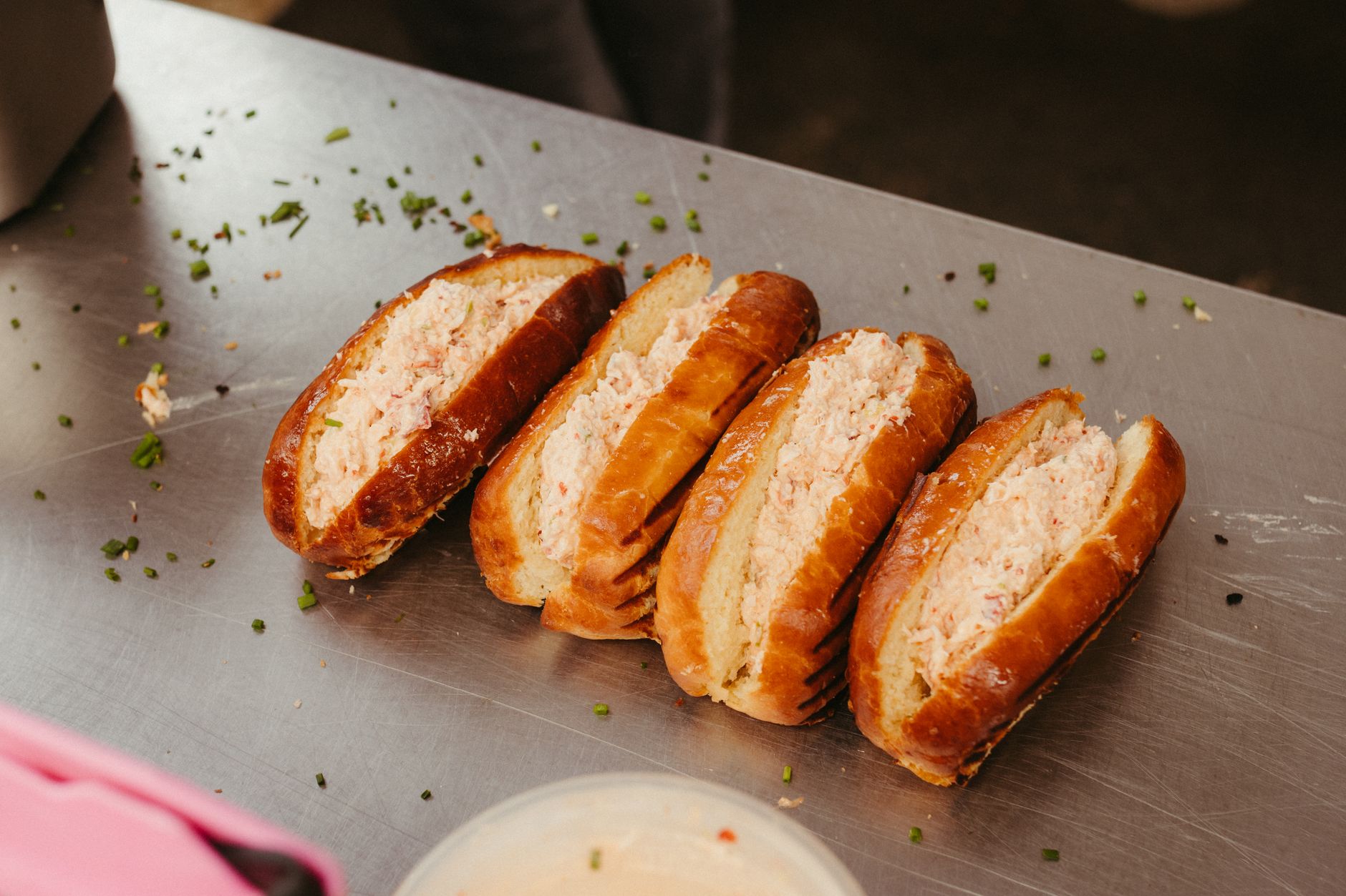 Warm Connecticut lobster roll drenched in butter with toasted bun