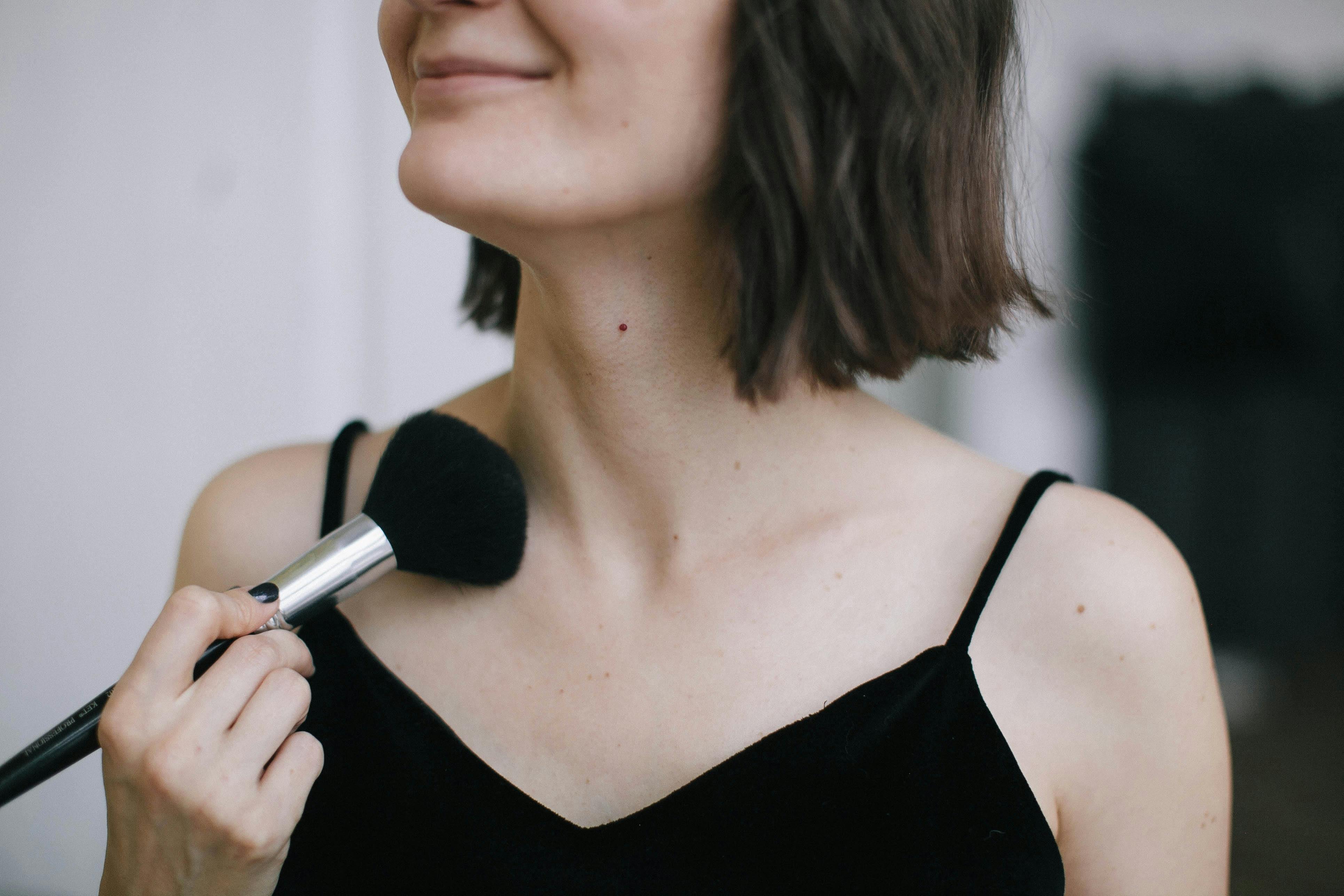 Woman Wearing Black Spaghetti Strap Top Using Makeup Brush · Free Stock ...