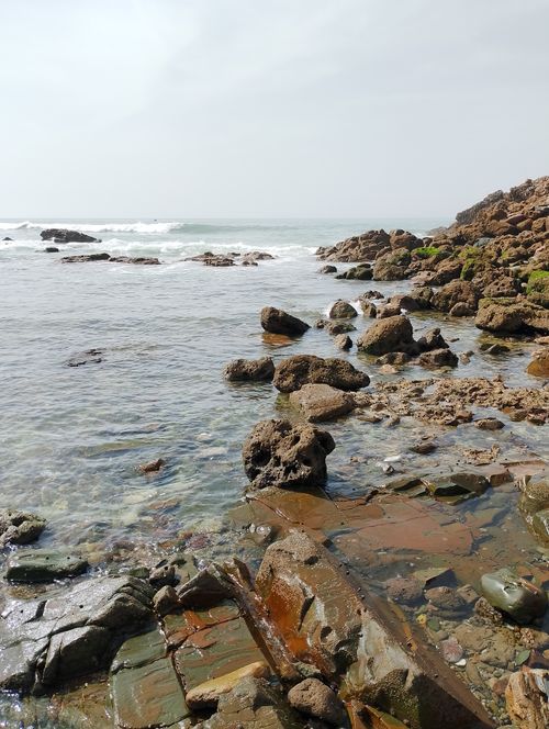 Free Explore the rugged beauty of Casablanca's rocky shoreline, bathed in summer's warm daylight. Stock Photo