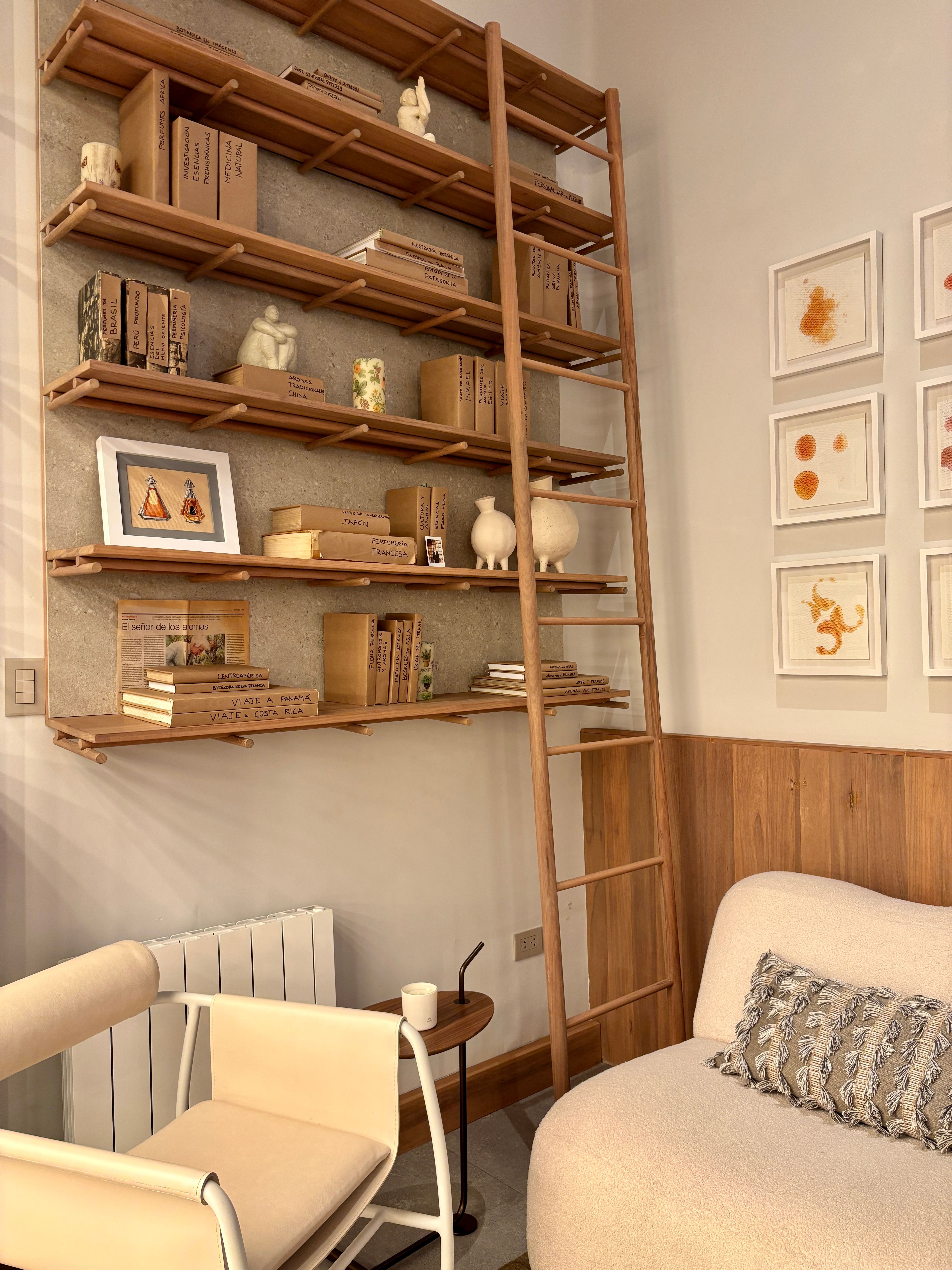 Free Bright and cozy minimalist living room with wooden shelves and neutral decor. Stock Photo