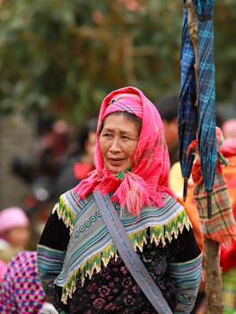 Portrait of a Hmong woman showcasing traditional attire in Lào Cai, Vietnam.