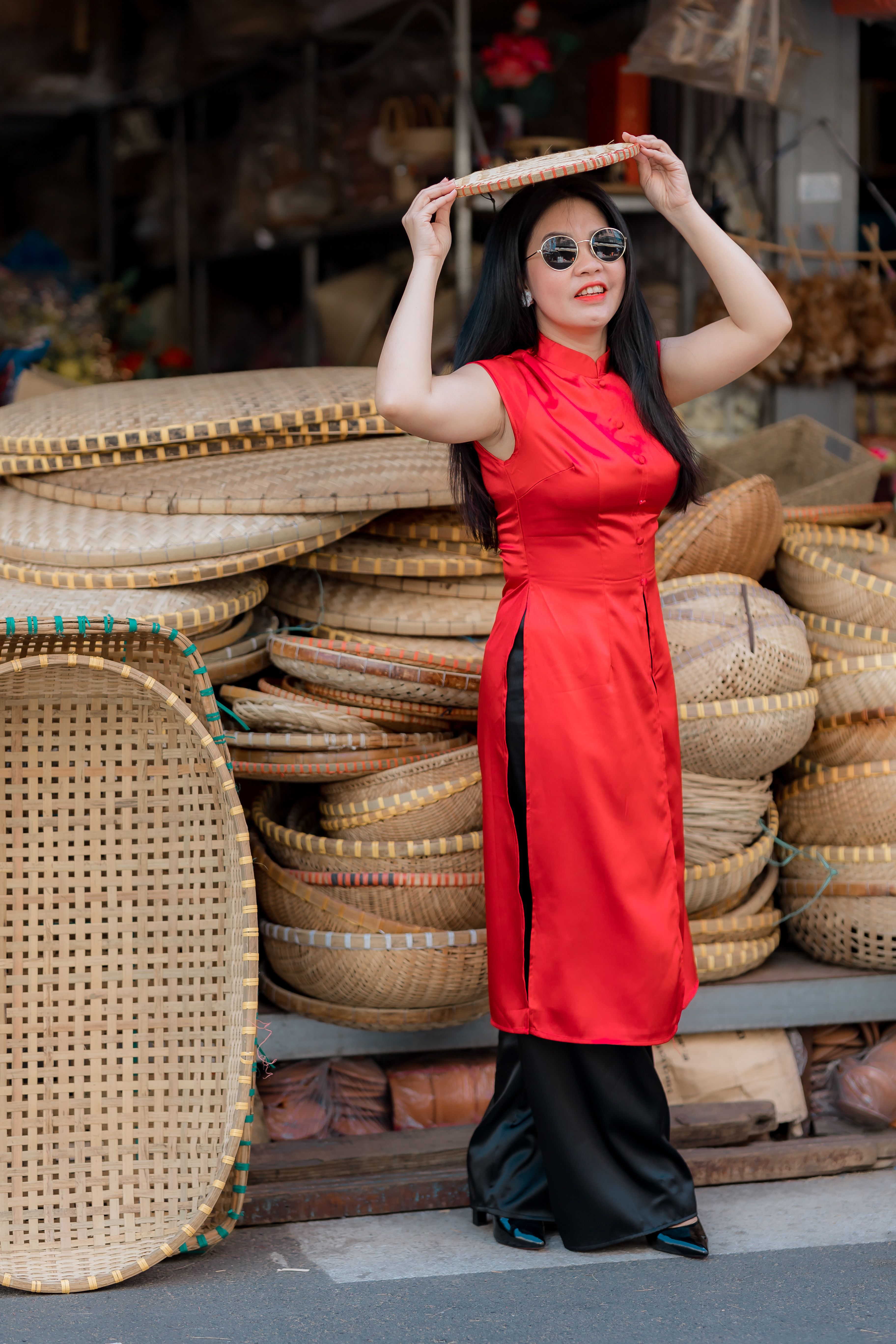 Woman in Red Dress Holding Straw Hat Outdoors · Free Stock Photo