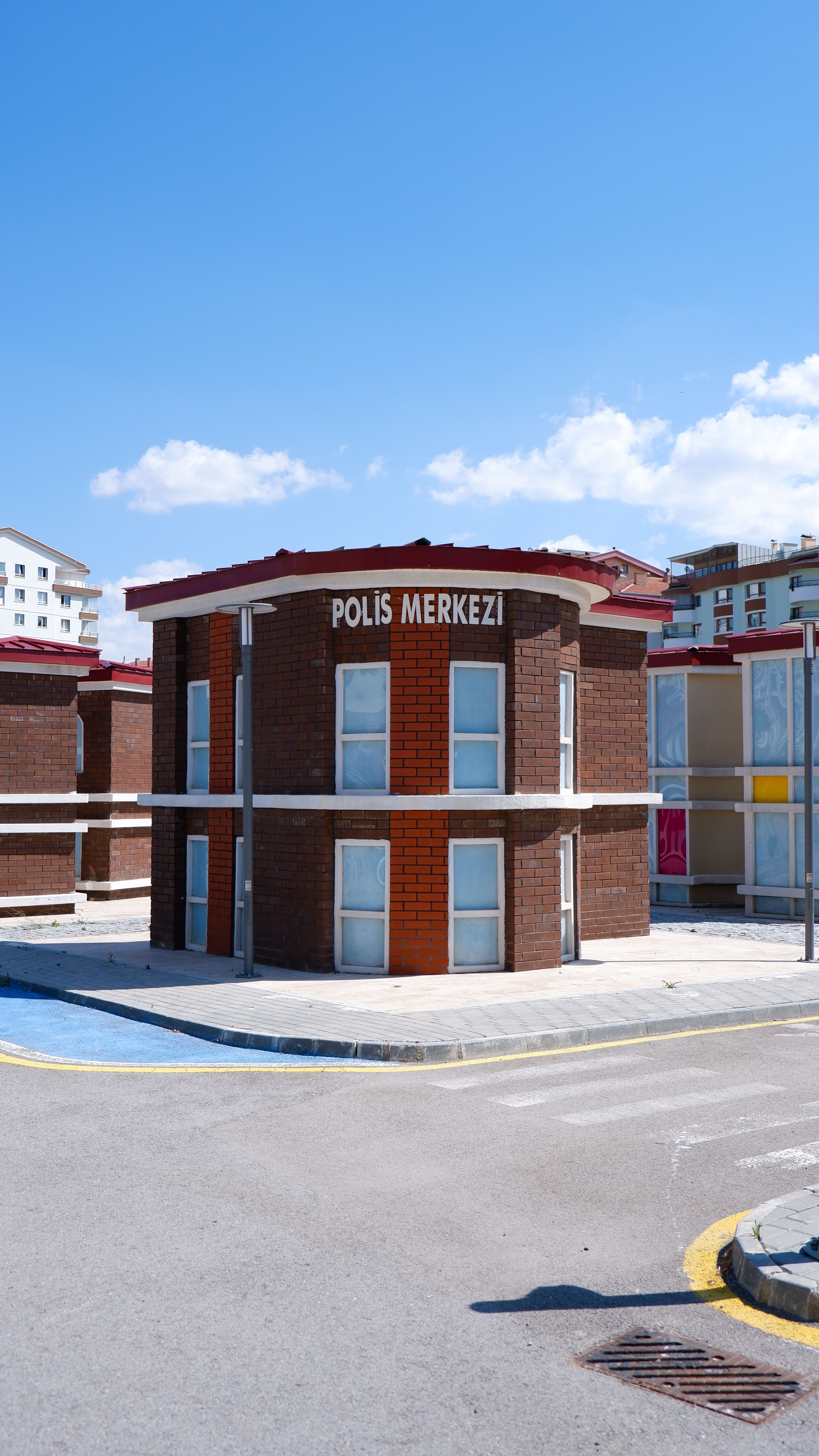 Modern round-shaped police station building in Ankara, Turkey, under clear blue skies.