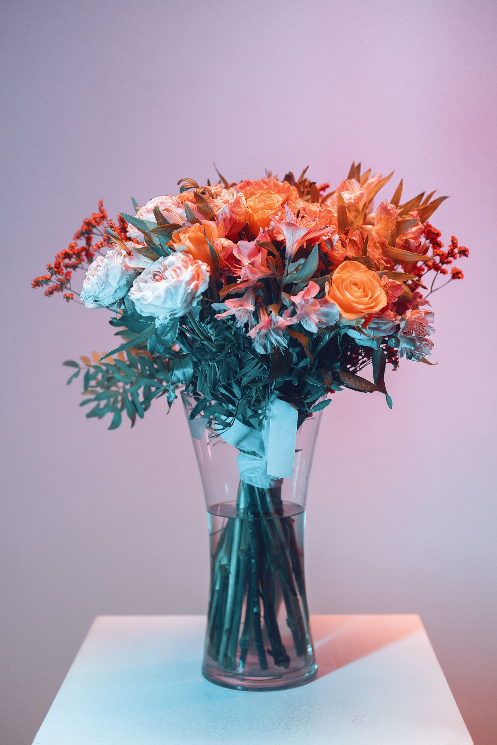 [ColoSach]-elegant-bouquet-of-mixed-flowers-in-a-glass-vase-with-soft-lighting.