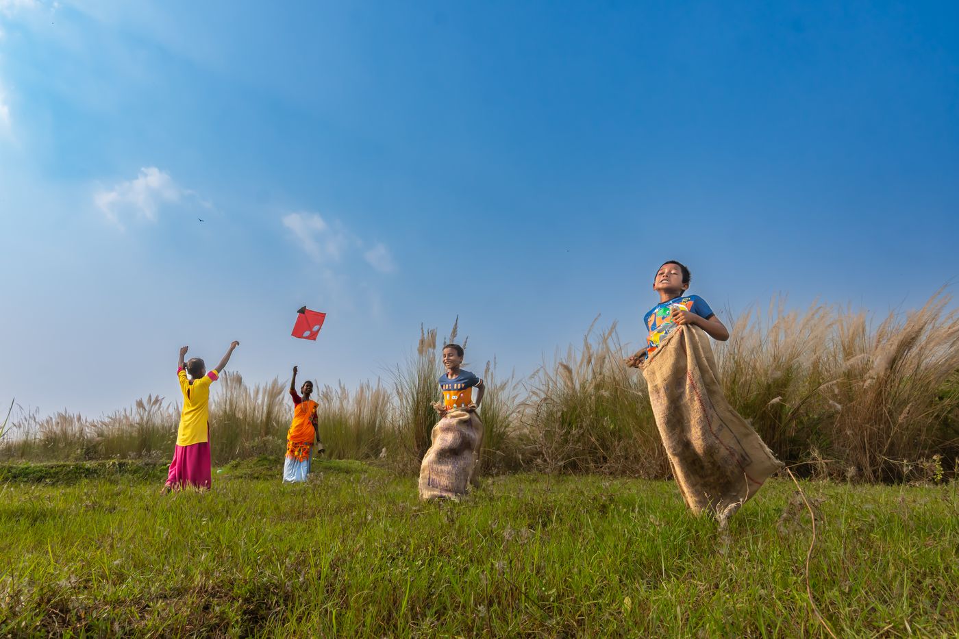 Children playing outdoors in rural India, reflecting youth energy, confidence, and shared momentum.