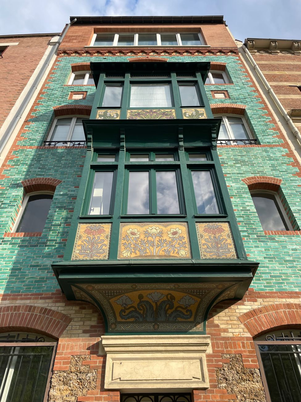 Explore this vibrant Art Nouveau building facade with intricate tile work and unique architecture.. pexels, explore, this