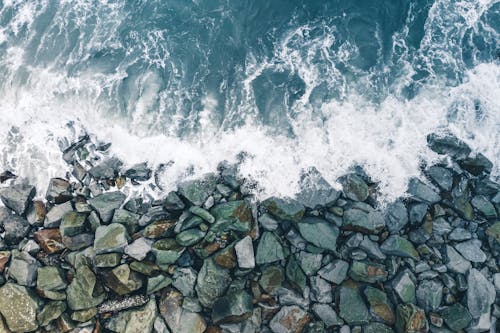 Free Waves Crashing on Coastal Rocks Stock Photo