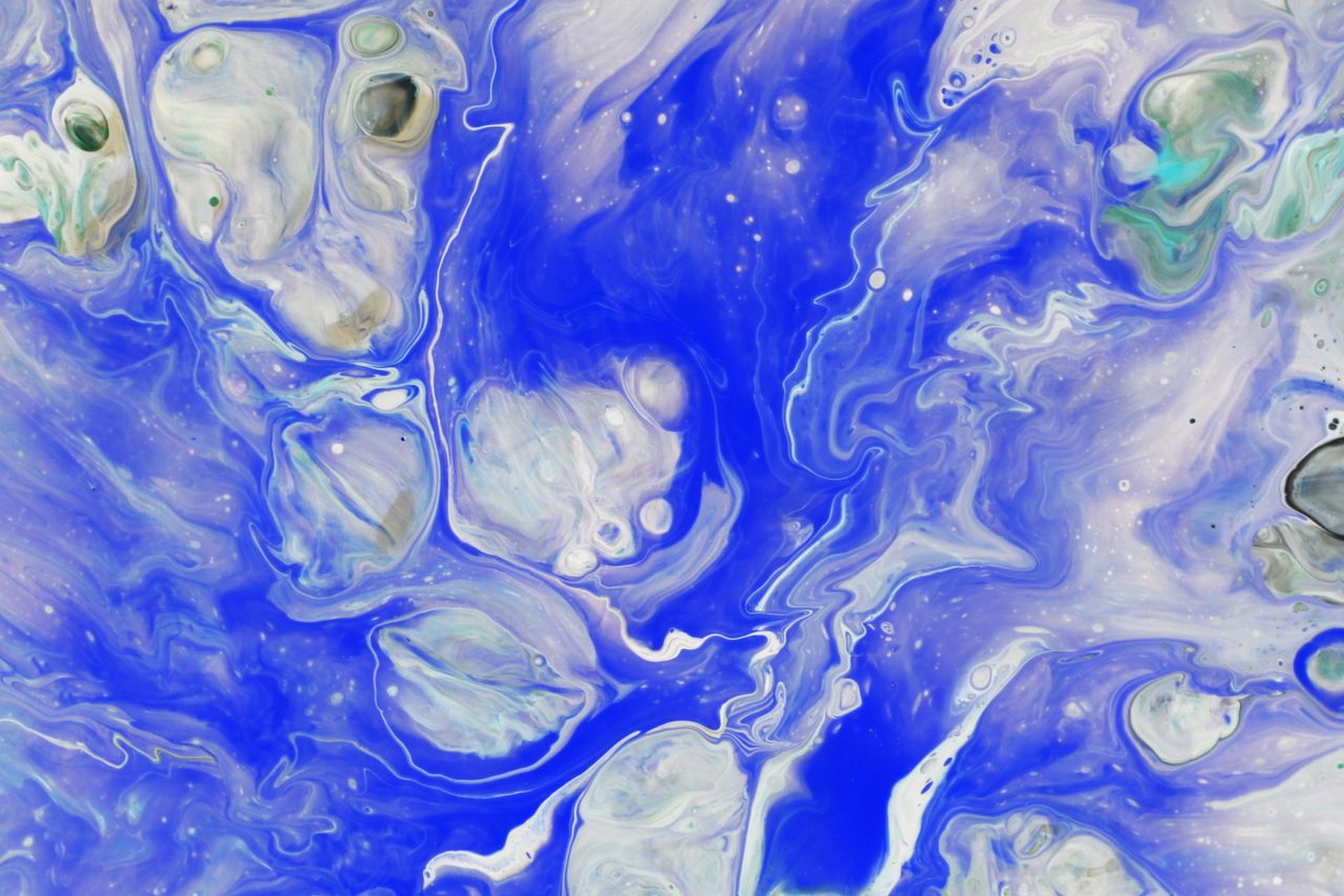 vivid abstract fluid art with dynamic blue and white swirls and marble
