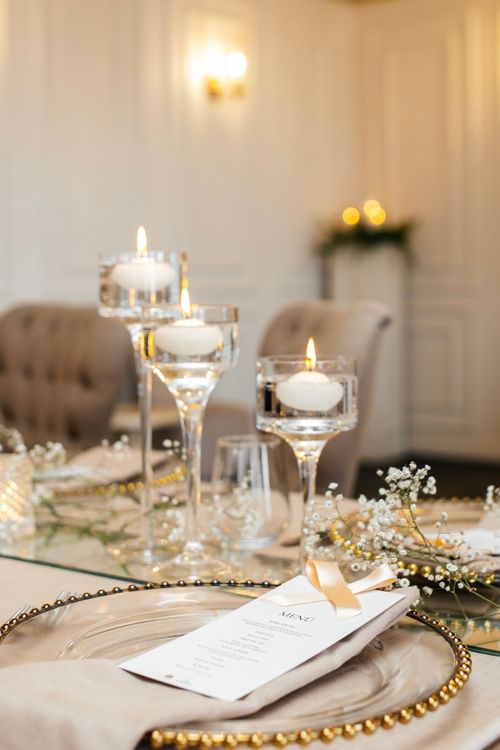 Elegant candlelit table setting for a New Year's Eve dinner