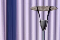 Modern Street Lamp Against Striped Wall