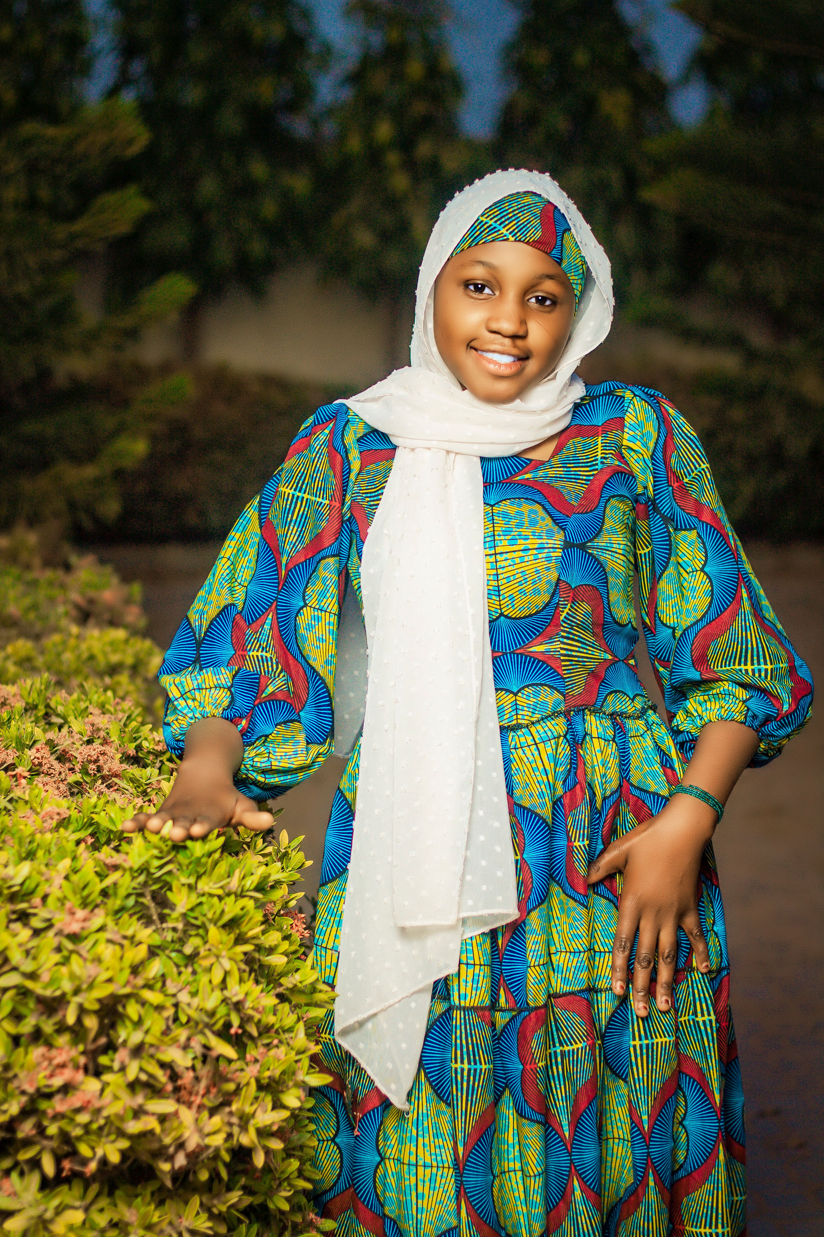 Young Woman in Vibrant Traditional Dress Outdoors · Free Stock Photo