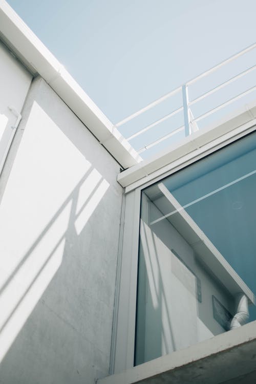 Free Photo Of A Glass Window On The Exterior Of A White Building  Stock Photo