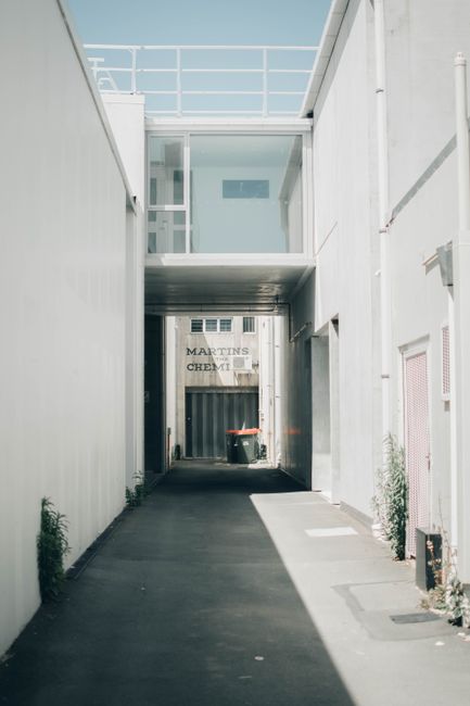 Explore this minimalist urban alleyway in Nelson, New Zealand, showcasing modern architecture and clean lines.