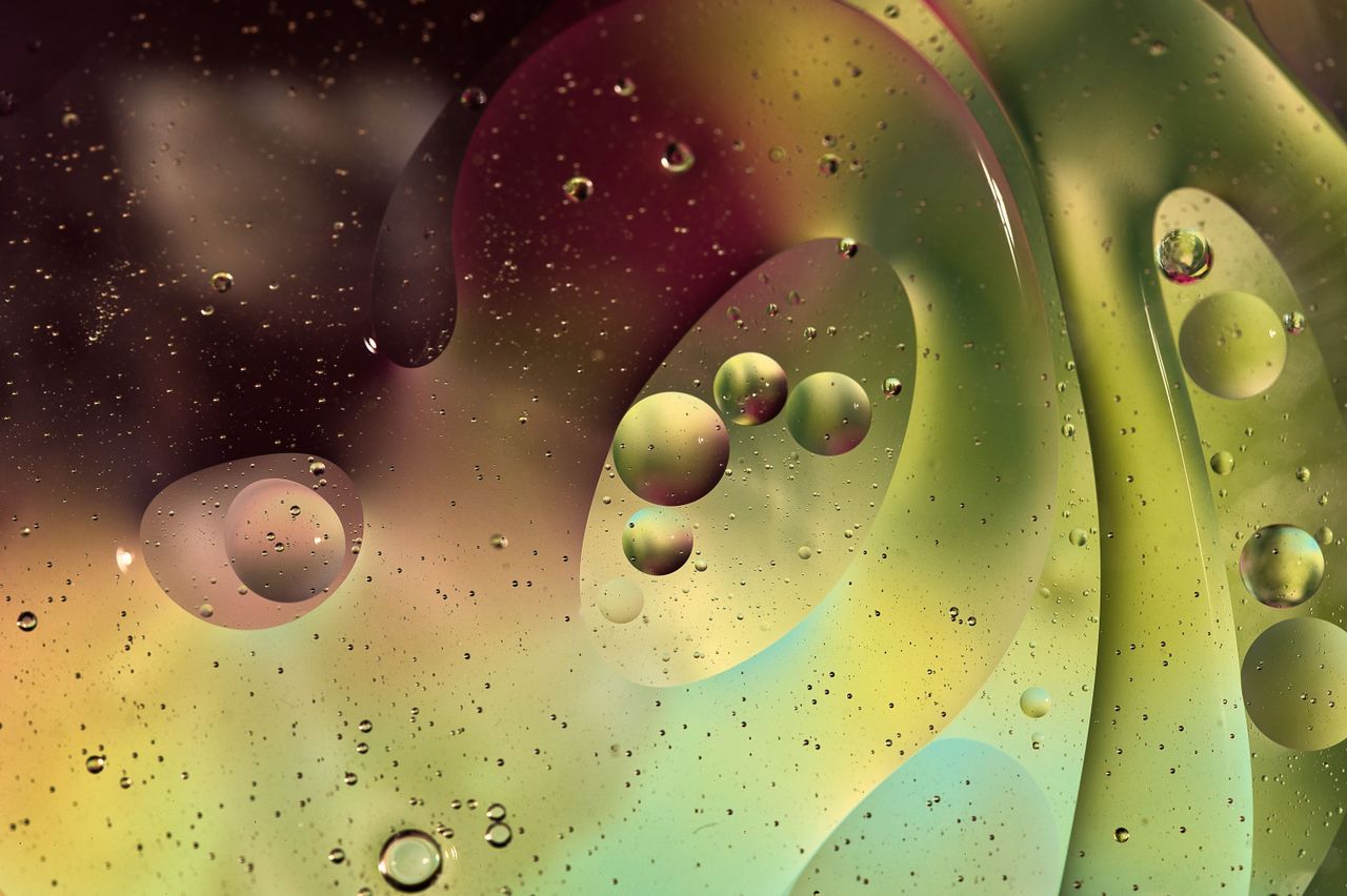 vibrant abstract image of oil bubbles on water with a colorful backgro
