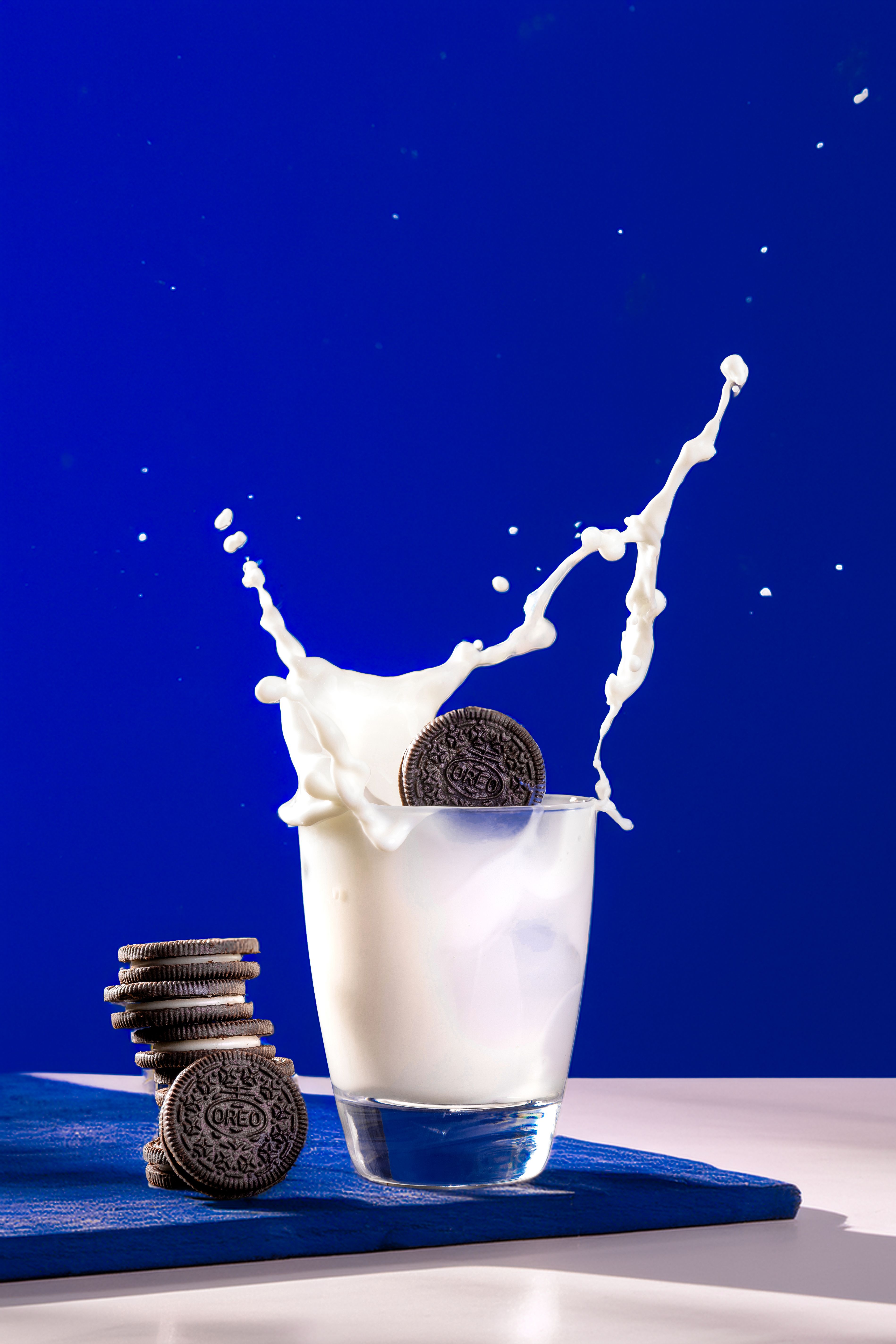 Chocolate Cookies and Milk Splashing in Glass · Free Stock Photo