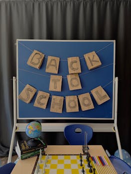 Creative back to school classroom setup with a board, globe, and chess.