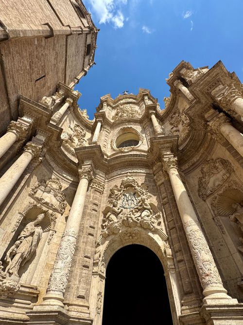 Free Elegant baroque cathedral facade soaring under a clear sky. Stock Photo