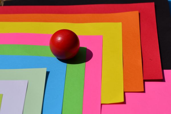 Assorted specialty paper sheets in layered colours