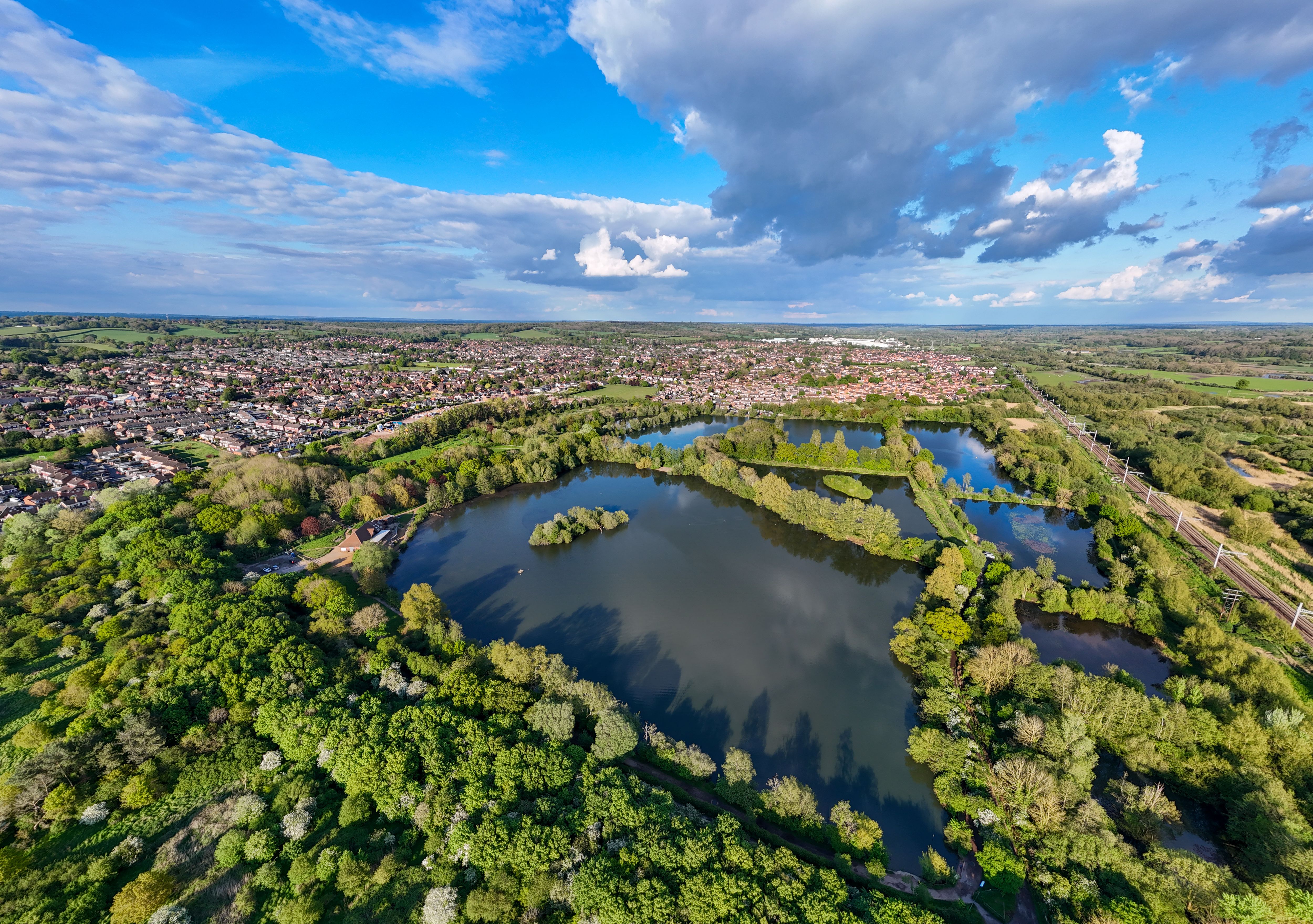 Aerial View of Green Landscape with Lakes and Railway · Free Stock Photo