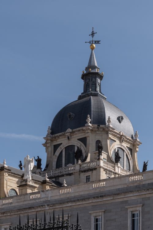 Free The striking dome of Almudena Cathedral in Madrid, showcasing intricate architecture under a clear blue sky. Stock Photo