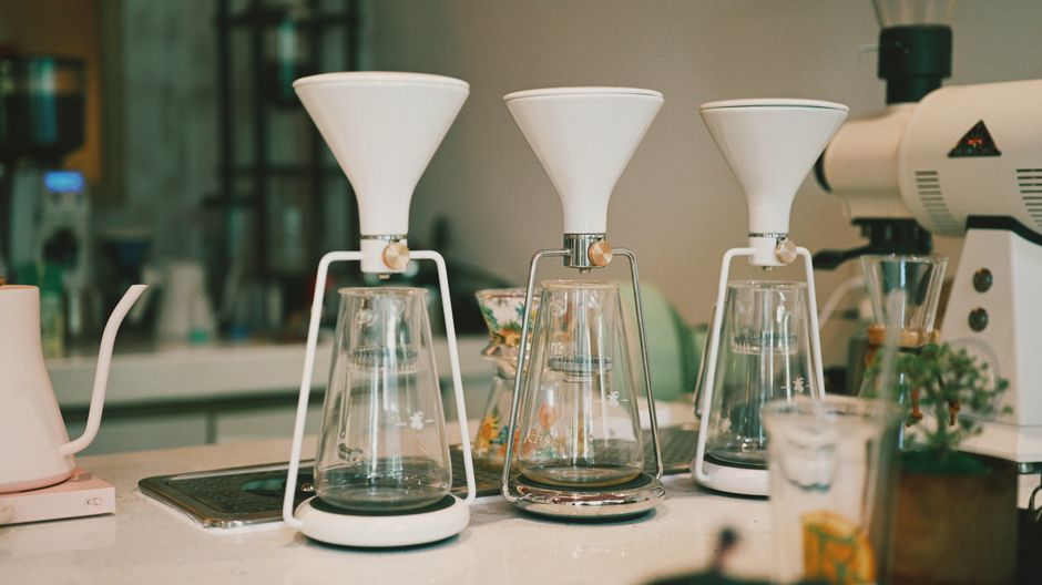 A minimalist coffee station showcasing elegant brewing equipment in a stylish cafe.