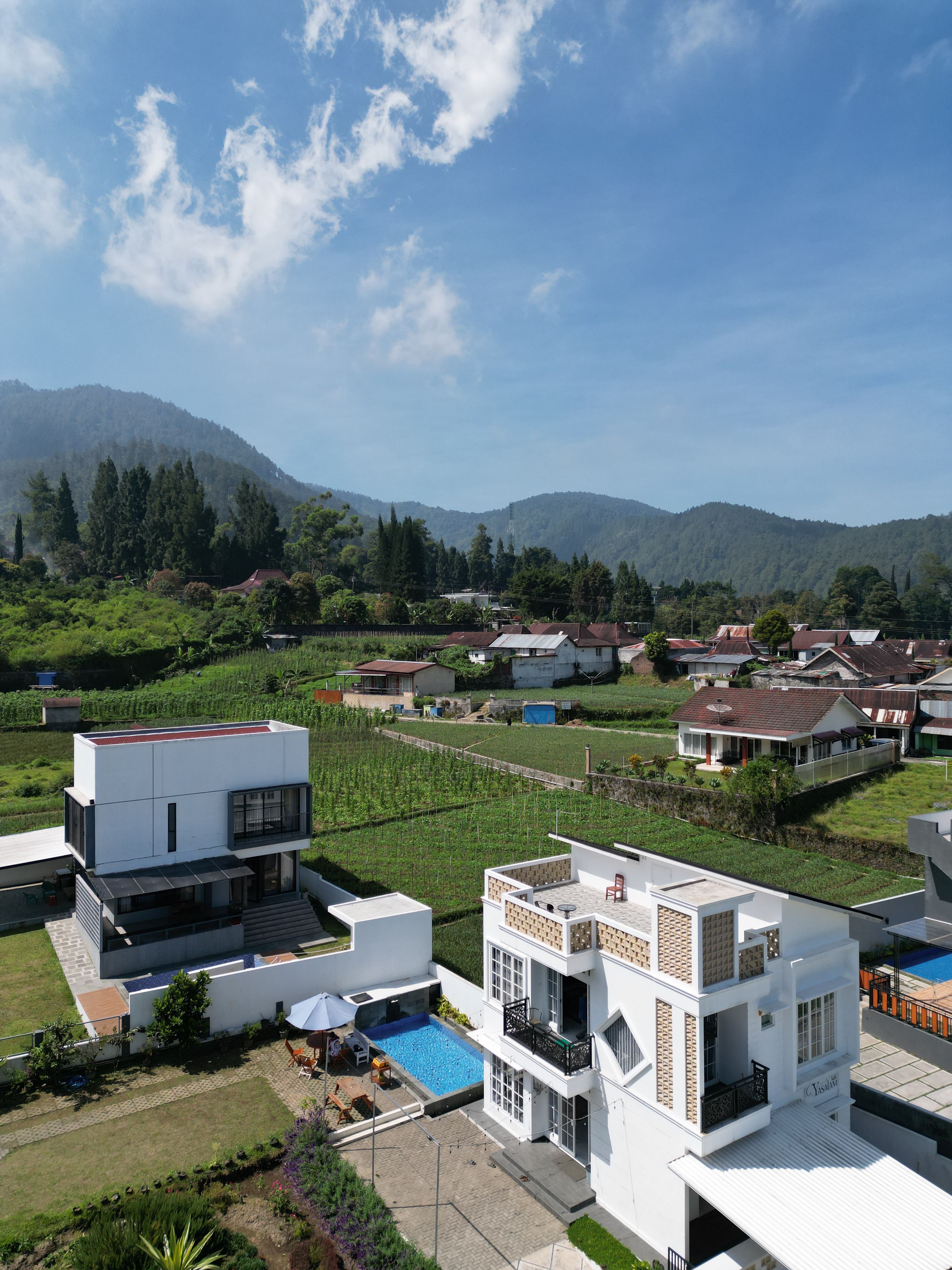 Aerial View of Modern Villa in Mountain Valley