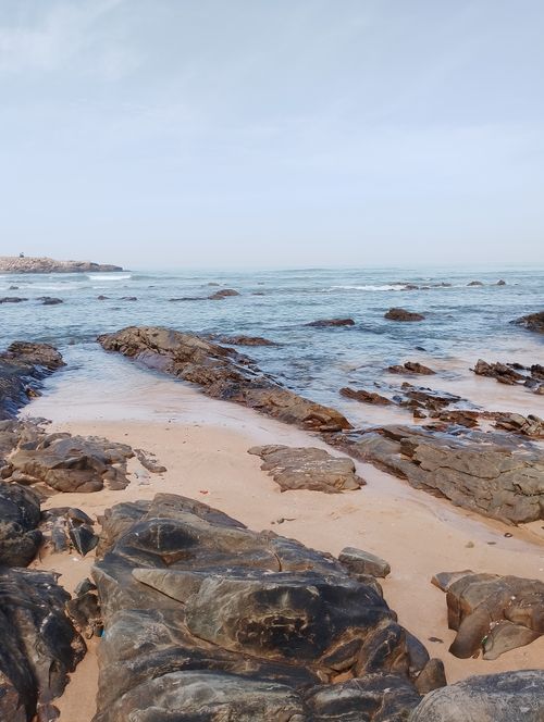 Free Explore the tranquility of Casablanca's rocky shoreline at low tide, showcasing natural beauty. Stock Photo