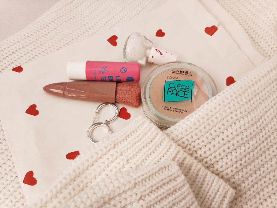 Makeup essentials on soft textile