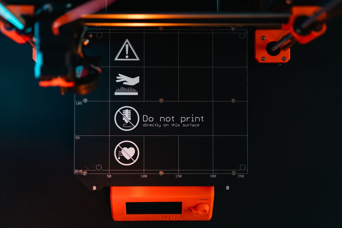Close-up top view of a 3D printer build plate