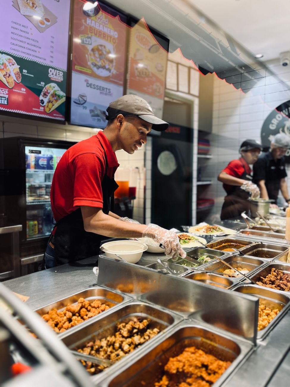 A fast-casual counter built for speed and repetition, the kind of setting that has to feel distinctive before it can cross borders.