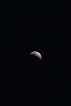 Stunning view of the half moon against a dark night sky. Ideal for night and astronomy themes.
