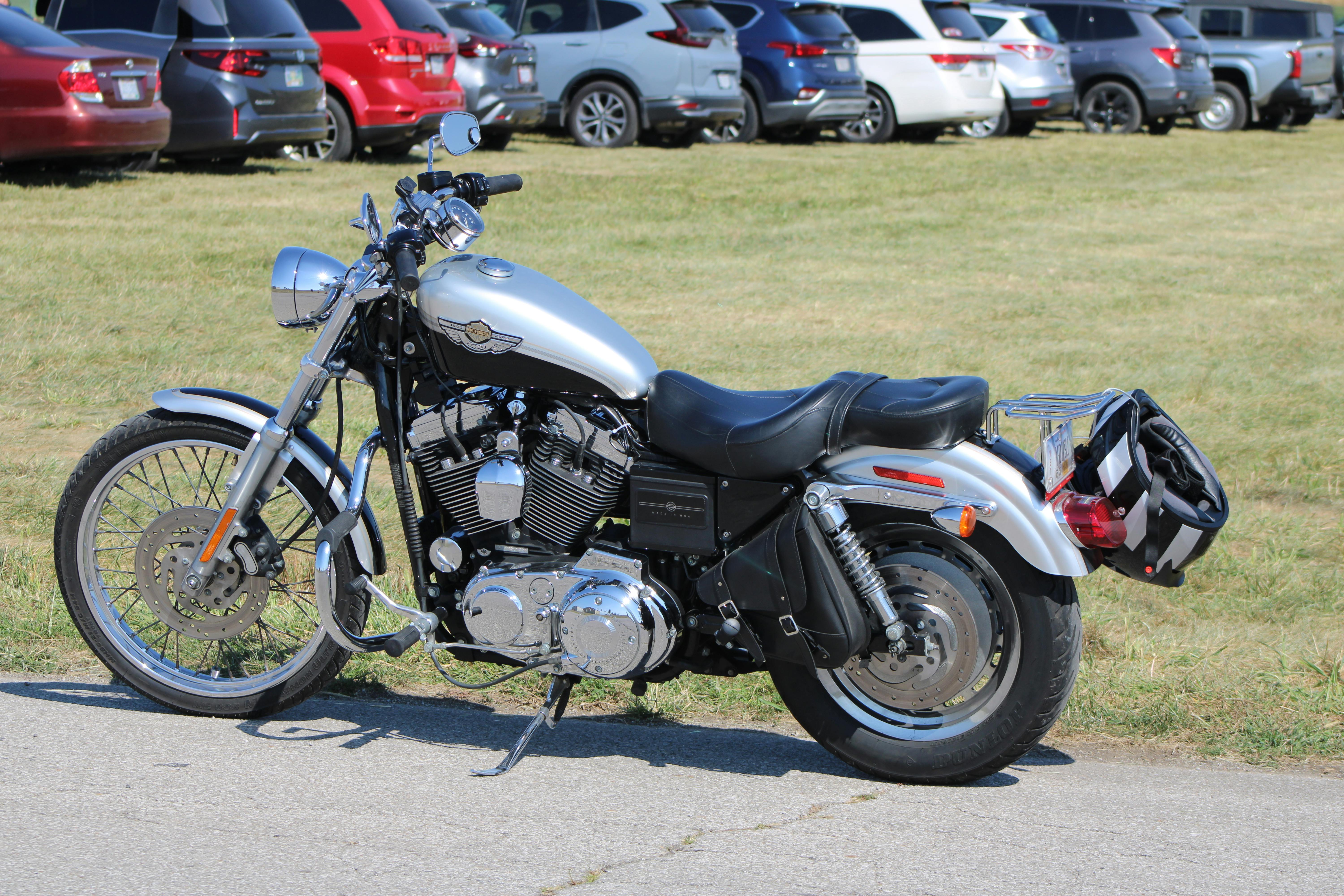 A sleek silver motorcycle parked outdoors on a sunny day in Circleville, Ohio.