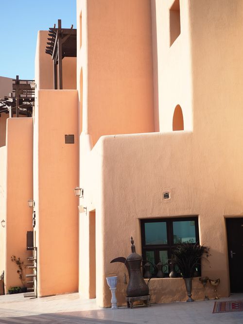 Free Explore the warm tones and geometric design of Middle Eastern architecture in Qatar. Stock Photo