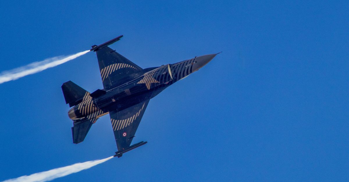 Dynamic Jet Fighter Performing in Clear Blue Sky · Free Stock Photo