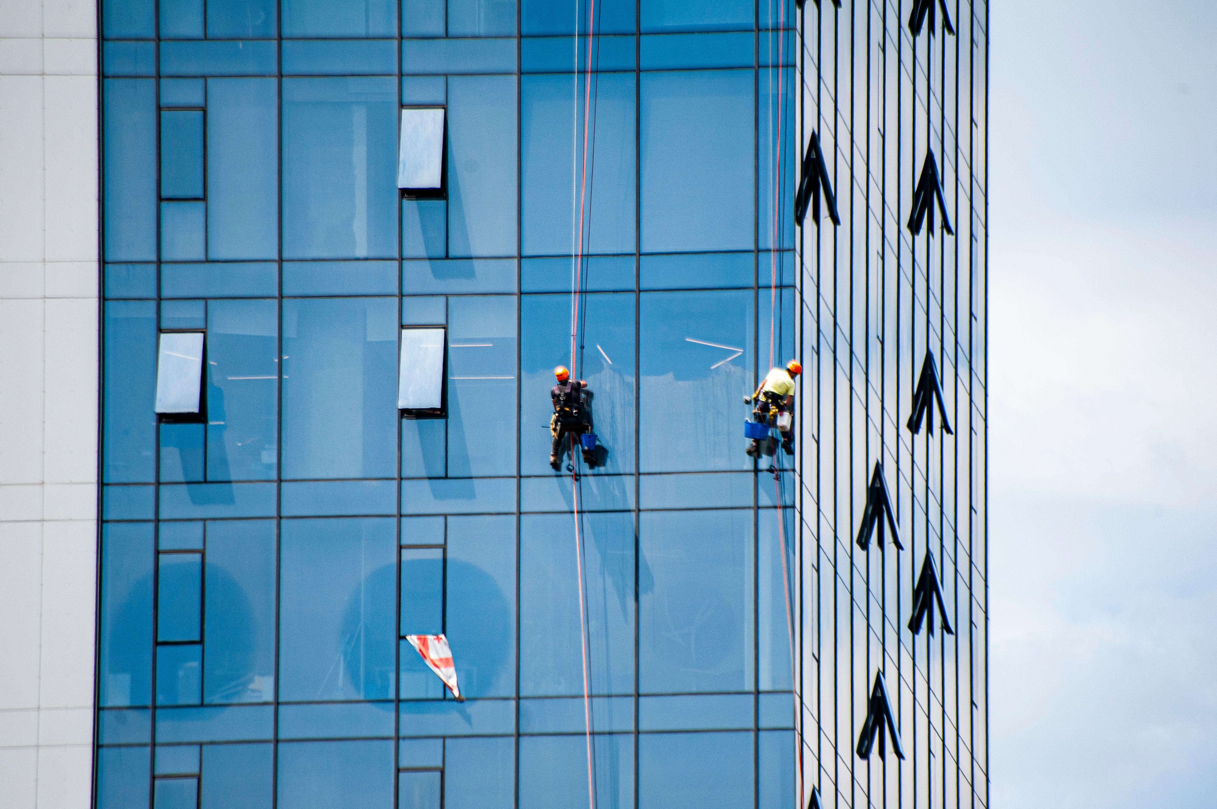 Window Cleaners on High-rise Building Exterior · Free Stock Photo