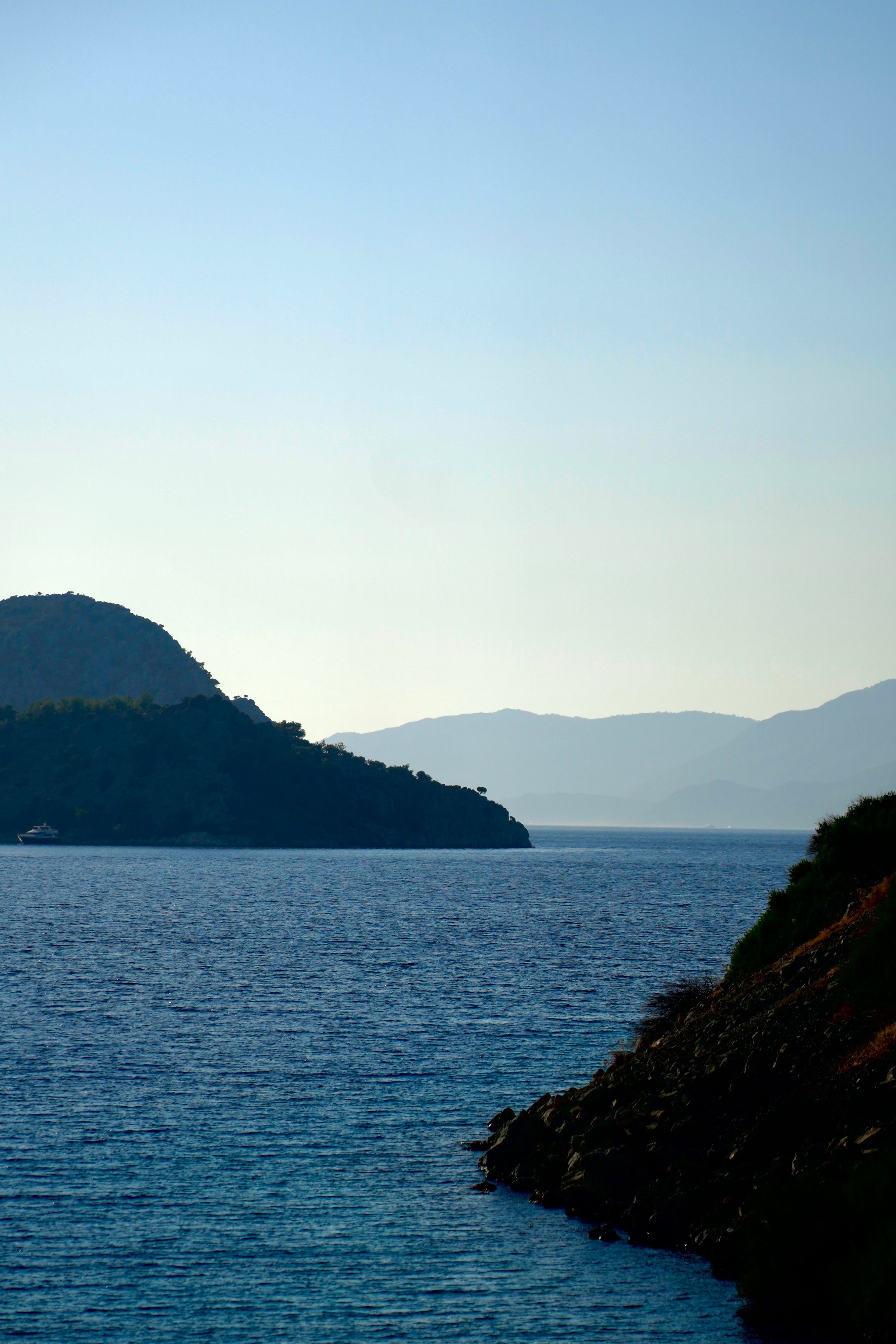 Tranquil Coastal Scene with Distant Hills · Free Stock Photo