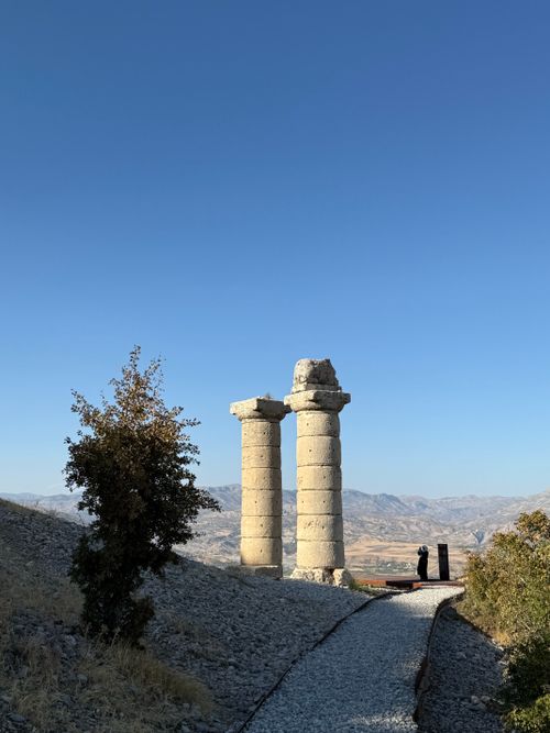 Free Explore historical stone columns in Adıyaman, Türkiye, under a clear blue sky. Stock Photo