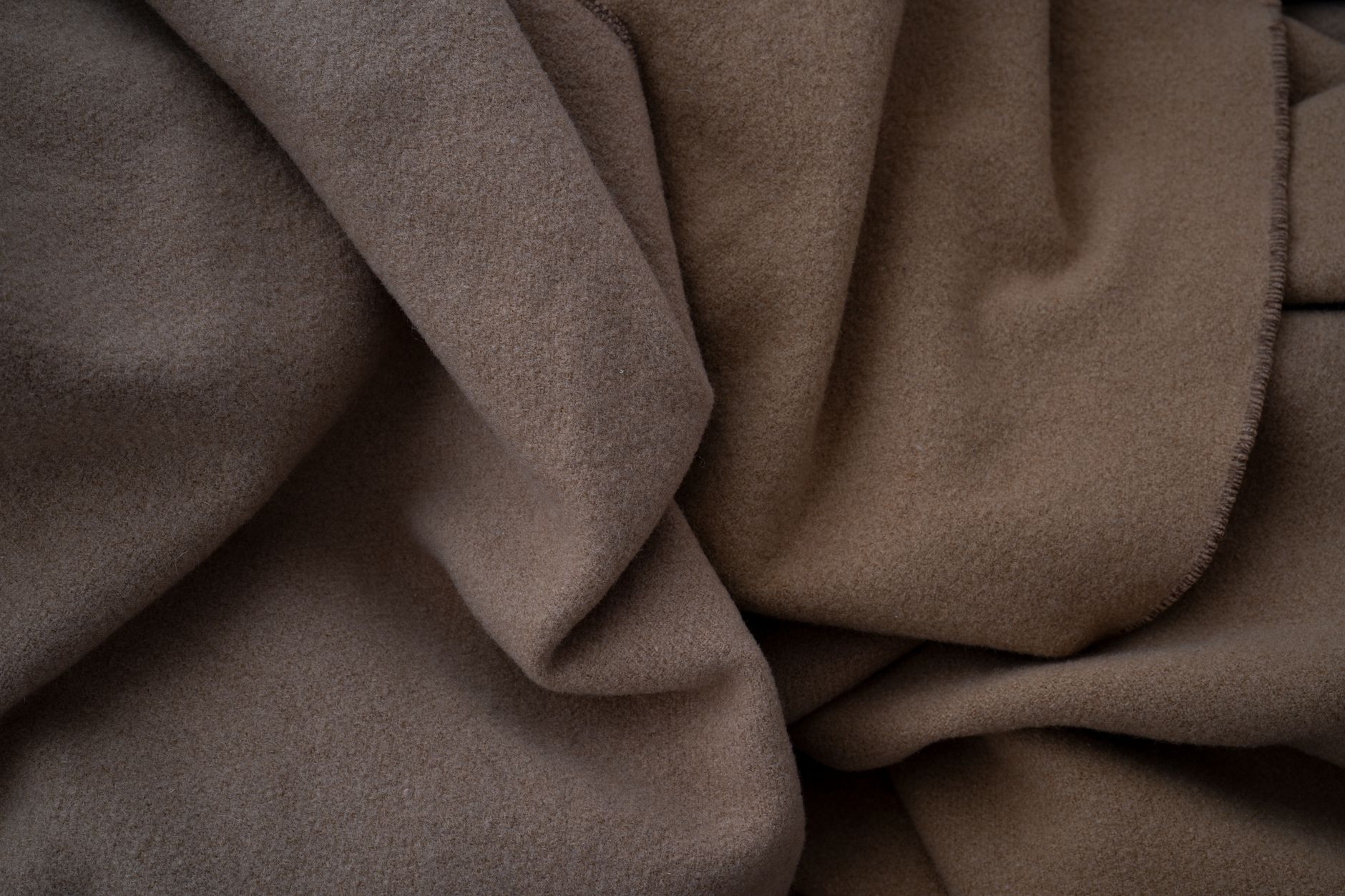 Close-up of a densely woven wool coating fabric used in winter outerwear