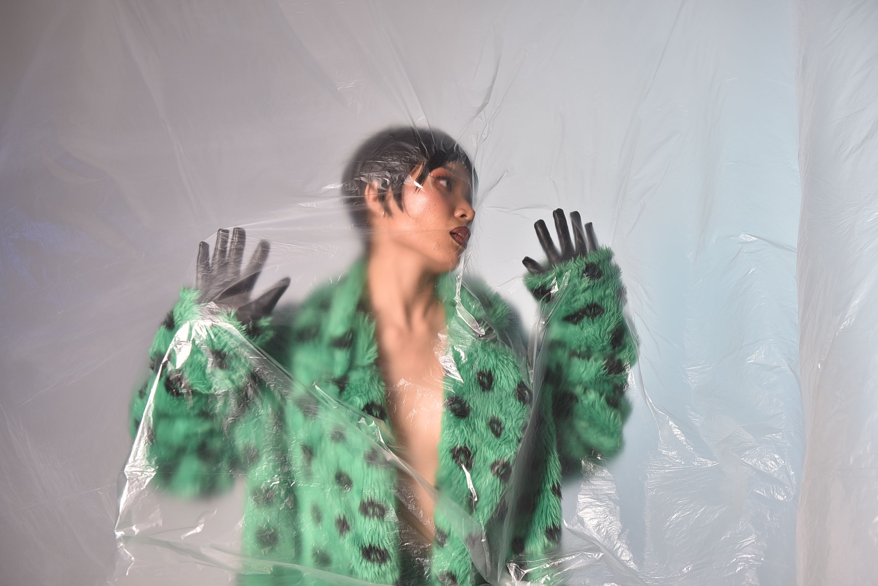 Fashion Portrait Behind Plastic Sheet · Free Stock Photo