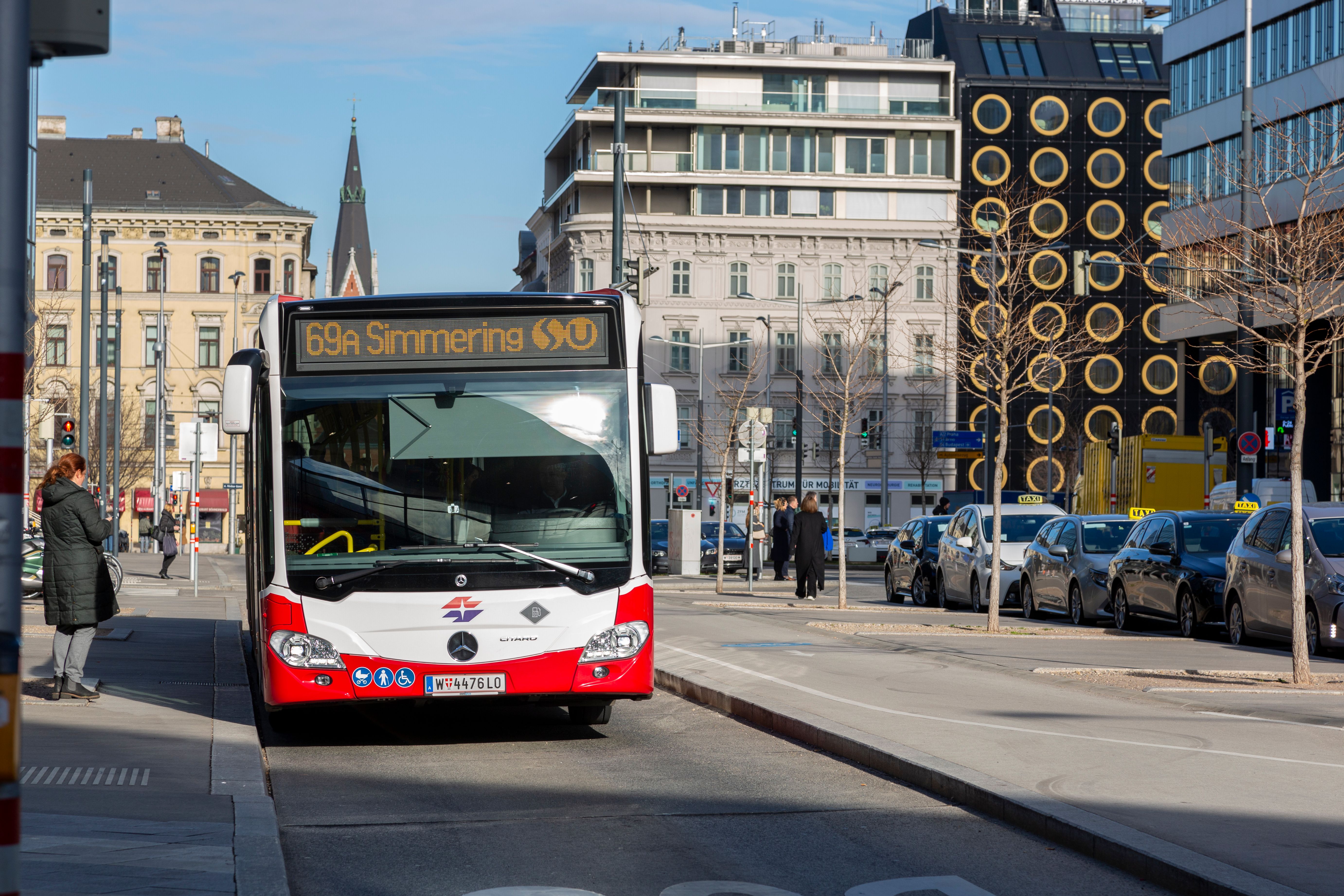City Bus in Urban Street Setting During Day · Free Stock Photo