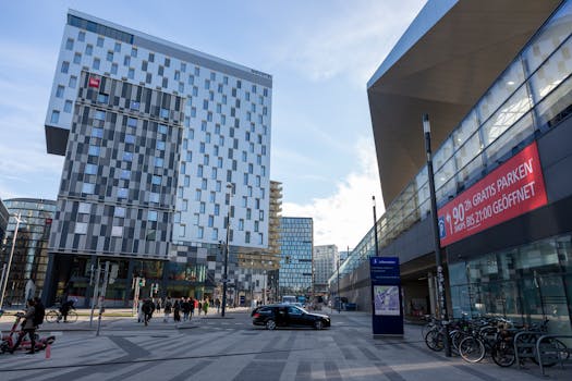 Wide view of a bustling urban area with modern architecture and active pedestrians.